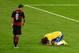BELO HORIZONTE, BRAZIL - JULY 08: David Luiz of Brazil reacts after being defeated 7-1 by Germany as Mesut Oezil of Germany looks on during the 2014 FIFA World Cup Brazil Semi Final match between Brazil and Germany at Estadio Mineirao on July 8, 2014 in