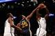 Nov 5, 2013; Brooklyn, NY, USA; Utah Jazz shooting guard Brandon Rush (25) fouls Brooklyn Nets power forward Reggie Evans (30) during the first quarter at Barclays Center. Mandatory Credit: Anthony Gruppuso-USA TODAY Sports