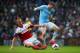 MANCHESTER, ENGLAND - MARCH 22: Steve Sidwell of Fulham tackles James Milner of Manchester City during the Barclays Premier League match between Manchester City and Fulham at Etihad Stadium on March 22, 2014 in Manchester, England. (Photo by Jan Kruger/