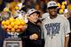 MIAMI GARDENS, FL - JANUARY 04: (L-R) Head coach Dana Holgorsen and Geno Smith #12 of the West Virginia Mountaineers celebrate after they won 70-33 against the Clemson Tigers during the Discover Orange Bowl at Sun Life Stadium on January 4, 2012 in Miami