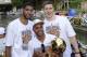 SAN ANTONIO, TX - JUNE 18: Tim Duncan, Patty Mills, and Aron Baynes of the San Antonio Spurs pose for photos during The San Antonio Spurs NBA Championship Celebration Parade on June 18, 2014 on the San Antonio River in San Antonio, Texas. NOTE TO USER: U