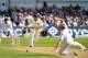 NOTTINGHAM, ENGLAND - JULY 09: India batsman Mahendra Singh Dhoni picks up some runs past bowler Joe Root during day one of the 1st Investec Test Match between England and India at Trent Bridge on July 9, 2014 in Nottingham, England. (Photo by Stu For