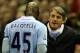 LIVERPOOL, ENGLAND - NOVEMBER 27: Manchester City Manager Roberto Mancini speaks to Mario Balotelli as he heads for the dressing room after being sent off during the Barclays Premier League match between Liverpool and Manchester City at Anfield on Novemb
