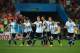 SAO PAULO, BRAZIL - JULY 09: (L-R) Lionel Messi, Pablo Zabaleta, Martin Demichelis, Lucas Biglia, Marcos Rojo, Rodrigo Palacio, Javier Mascherano, Ezequiel Garay and Maxi Rodriguez of Argentina react after a made penalty kick by teammate Sergio Aguero (no