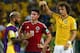 FORTALEZA, BRAZIL - JULY 04: Dani Alves (L) and David Luiz of Brazil console James Rodriguez of Colombia after Brazil's 2-1 win during the 2014 FIFA World Cup Brazil Quarter Final match between Brazil and Colombia at Castelao on July 4, 2014 in Fortaleza