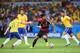 BELO HORIZONTE, BRAZIL - JULY 08: Sami Khedira (C) of Germany runs past Oscar (L) of Brazil with the ball during the 2014 FIFA World Cup Brazil Semi Final match between Brazil and Germany at Estadio Mineirao on July 8, 2014 in Belo Horizonte, Brazil. (P