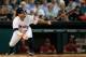 HOUSTON, TX - JUNE 03: Jose Altuve #27 of the Houston Astros hits a single in the first inning of their game against the Los Angeles Angels of Anaheim at Minute Maid Park on June 3, 2014 in Houston, Texas. (Photo by Scott Halleran/Getty Images)
