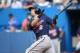 TORONTO, CANADA - JUNE 9: Brian Dozier #2 of the Minnesota Twins hits a solo home run in the first inning during MLB game action against the Toronto Blue Jays on June 9, 2014 at Rogers Centre in Toronto, Ontario, Canada. (Photo by Tom Szczerbowski/Getty I