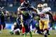 SEATTLE, WA - JANUARY 19: Running back Marshawn Lynch #24 of the Seattle Seahawks carries the ball against the San Francisco 49ers during the 2014 NFC Championship at CenturyLink Field on January 19, 2014 in Seattle, Washington. (Photo by Jonathan Ferre