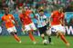 SAO PAULO, BRAZIL - JULY 09: Lionel Messi of Argentina controls the ball as (L-R) Georginio Wijnaldum, Nigel de Jong and Ron Vlaar give chase during the 2014 FIFA World Cup Brazil Semi Final match between the Netherlands and Argentina at Arena de Sao Pau