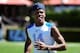Jul 10, 2014; Beaverton, OR, USA; Land Shark quarterback Deondre Francois (14) runs onto the field during Nike Football ' The Opening' at Nike World Headquarters. Mandatory Credit: Steve Dykes-USA TODAY Sports