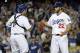 Jul 10, 2014; Los Angeles, CA, USA; Los Angeles Dodgers starting pitcher Clayton Kershaw (22) and catcher A.J. Ellis (17) celebrate after defeating the San Diego Padres 2-1 at Dodger Stadium. Mandatory Credit: Richard Mackson-USA TODAY Sports