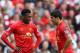 LIVERPOOL, ENGLAND - MARCH 30: Luis Suarez (R) and Daniel Sturridge of Liverpool prepare to kick off during the Barclays Premier League match between Liverpool and Tottenham Hotspur at Anfield on March 30, 2014 in Liverpool, England. (Photo by Alex Live