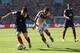 RIO DE JANEIRO, BRAZIL - JULY 04: Mathieu Debuchy of France and Mesut Oezil of Germany compete for the ball during the 2014 FIFA World Cup Brazil Quarter Final match between France and Germany at Maracana on July 4, 2014 in Rio de Janeiro, Brazil. (Pho
