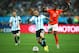 SAO PAULO, BRAZIL - JULY 09: Javier Mascherano of Argentina controls the ball as Georginio Wijnaldum of the Netherlands gives chase during the 2014 FIFA World Cup Brazil Semi Final match between the Netherlands and Argentina at Arena de Sao Paulo on July