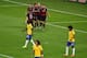 BELO HORIZONTE, BRAZIL - JULY 08: Andre Schuerrle of Germany celebrates scoring his team's sixth goal with teammates Mesut Oezil, Toni Kroos, Benedikt Hoewedes and Thomas Mueller as dejected Brazil players look on during the 2014 FIFA World Cup Brazil Se