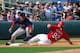 Mar 5, 2014; Jupiter, FL, USA; St. Louis Cardinals center fielder James Ramsey (92) is tagged out by Boston Red Sox third baseman Will Middlebrooks (16) after trying to advance on a fly ball at Roger Dean Stadium. The Cardinals defeated the Red Sox 8-6. M