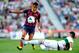 ELCHE, SPAIN - MAY 11: Alexis Sanchez of FC Barcelona competes for the ball Domingo Cisma of Elche FC during the La Liga match between Elche FC and FC Barcelona at Estadio Manuel Martinez Valero on May 11, 2014 in Elche, Spain. (Photo by David Ramos/Get