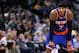 Mar 30, 2014; Oakland, CA, USA; New York Knicks forward Carmelo Anthony (7) rest on the court against the Golden State Warriors in the third quarter at Oracle Arena. The Knicks won 89-84. Mandatory Credit: Cary Edmondson-USA TODAY Sports