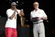MIAMI, FL - JUNE 25: Dwyane Wade #3 of the Miami Heat speaks on stage as the Miami Heat President Pat Riley looks on during a rally for the 2012 NBA Champions Miami Heat at American Airlines Arena on June 25, 2012 in Miami, Florida. NOTE TO USER: User e