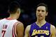 HOUSTON, TX - JANUARY 08: Steve Nash #10 of the Los Angeles Lakers waits on the court alongside Jeremy Lin #7 of the Houston Rockets at Toyota Center on January 8, 2013 in Houston, Texas. Nash became just the fifth player in NBA history to reach 10,000 c