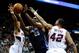 Apr 14, 2014; Atlanta, GA, USA; Charlotte Bobcats center Al Jefferson (25) controls the ball between Atlanta Hawks forward Cartier Martin (20) and forward Elton Brand (42) during the first half at Philips Arena. Mandatory Credit: Dale Zanine-USA TODAY Sp