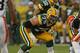 GREEN BAY, WI - AUGUST 16: Bryan Bulaga #75 of the Green Bay Packers awaits the snap against the Cleveland Browns during a preseason game at Lambeau Field on August 16, 2012 in Green Bay, Wisconsin. The Browns defeated the Packers 35-10. (Photo by Jonatha