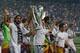 MADRID, SPAIN - MAY 25: Real Madrid player Sami Khedira (L) lifts the trophy during the Real Madrid celebration the day after winning the UEFA Champions League final at Santiago Bernabeu Stadium on May 25, 2014 in Madrid, Spain. Real Madrid CF achieves t