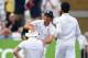 NOTTINGHAM, ENGLAND - JULY 12: England captain Alastair Cook (c) congratulates Ben Stokes after he had caught India batsman Cheteshwar Pujara during day four of the 1st Investec Test Match between England and India at Trent Bridge on July 12, 2014 in N