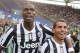 ROME, ITALY - MAY 11: Paul Labile Pogba with Carlos Tevez of Juventus celebrate the victory after the Serie A match between AS Roma and Juventus at Stadio Olimpico on May 11, 2014 in Rome, Italy. (Photo by Paolo Bruno/Getty Images)
