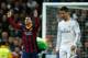 MADRID, SPAIN - MARCH 23: Lionel Messi of Barcelona celebrates scoring his team's third goal as Cristiano Ronaldo of Real Madrid looks dejected during the La Liga match between Real Madrid CF and FC Barcelona at the Bernabeu on March 23, 2014 in Madrid,