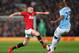 MANCHESTER, ENGLAND - MARCH 25: Tom Cleverley of Manchester United competes with Fernandinho of Manchester City during the Barclays Premier League match between Manchester United and Manchester City at Old Trafford on March 25, 2014 in Manchester, Englan