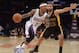 Feb 28, 2014; Los Angeles, CA, USA; Sacramento Kings guard Isaiah Thomas (22) is defended by Los Angeles Lakers guard Kendall Marshall (12) at Staples Center. Mandatory Credit: Kirby Lee-USA TODAY Sports