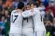 MADRID, SPAIN - NOVEMBER 09: Karim Benzema (2ndL) celebrates scoring their second goal with teammates Cristiano Ronaldo (2ndR), Gareth Bale (R) and Alvaro Arbeloa (L) during the La Liga match between Real Madrid CF and Real Sociedad de Futbol at Estadio