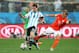 SAO PAULO, BRAZIL - JULY 09: Lionel Messi of Argentina is tackled by Dirk Kuyt of the Netherlands during the 2014 FIFA World Cup Brazil Semi Final match between the Netherlands and Argentina at Arena de Sao Paulo on July 9, 2014 in Sao Paulo, Brazil. (Ph