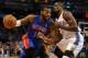 Apr 16, 2014; Oklahoma City, OK, USA; Detroit Pistons forward Greg Monroe (10) drives to the basket against Oklahoma City Thunder forward Serge Ibaka (9) during the first quarter at Chesapeake Energy Arena. Mandatory Credit: Mark D. Smith-USA TODAY Sport