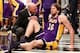 Feb. 5, 2013; Brooklyn, NY, USA; Los Angeles Lakers power forward Pau Gasol (16) is checked by the trainer after an apparent injury on the court against the Brooklyn Nets during the second half at Barclays Center. Lakers won 92-83. Mandatory Credit: Debby