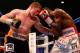 LAS VEGAS, NV - JULY 12: (L-R) Canelo Alvarez digs a left to the body of Erislandy Lara during their junior middleweight bout at the MGM Grand Garden Arena on July 12, 2014 in Las Vegas, Nevada. Alvarez defeated Lara by split decision. (Photo by Josh He