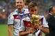RIO DE JANEIRO, BRAZIL - JULY 13: Mario Goetze of Germany kisses the World Cup trophy after defeating Argentina 1-0 in extra time during the 2014 FIFA World Cup Brazil Final match between Germany and Argentina at Maracana on July 13, 2014 in Rio de Jane