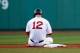 BOSTON, MA - JULY 08: Mike Napoli #12 of the Boston Red Sox sits at second base after sliding into an inning-ending double play in the first inning against the Chicago White Sox during the game at Fenway Park on July 8, 2014 in Boston, Massachusetts. (Ph