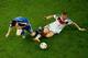 RIO DE JANEIRO, BRAZIL - JULY 13: Bastian Schweinsteiger of Germany tackles Lionel Messi of Argentina during the 2014 FIFA World Cup Brazil Final match between Germany and Argentina at Maracana on July 13, 2014 in Rio de Janeiro, Brazil. (Photo by Fabriz