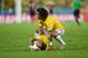 FORTALEZA, BRAZIL - JULY 04: Neymar of Brazil lies on the field after a challenge as teammate Marcelo reacts during the 2014 FIFA World Cup Brazil Quarter Final match between Brazil and Colombia at Castelao on July 4, 2014 in Fortaleza, Brazil. (Photo b