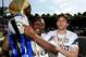 SIENA, ITALY - MAY 16: Sulley Muntari and Diego Alberto Milito of FC Internazionale Milano celebrate with the league trophy after the Serie A match between AC Siena and FC Internazionale Milano at Stadio Artemio Franchi on May 16, 2010 in Siena, Italy.