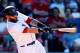 BOSTON, MA - JULY 6: Mike Napoli #12 of the Boston Red Sox singles in the tying runin the seventh inning against the Baltimore Orioles at Fenway Park on July 6, 2014 in Boston, Massachusetts. (Photo by Jim Rogash/Getty Images)