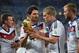 RIO DE JANEIRO, BRAZIL - JULY 13: Mats Hummels and Matthias Ginter celebrate with the World Cup trophy after defeating Argentina 1-0 in extra time during the 2014 FIFA World Cup Brazil Final match between Germany and Argentina at Maracana on July 13, 20