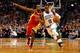 BOSTON, MA - JANUARY 11: Rajon Rondo #9 of the Boston Celtics carries the ball past Toney Douglas #15 of the Houston Rockets during the game on January 11, 2013 at TD Garden in Boston, Massachusetts. NOTE TO USER: User expressly acknowledges and agrees th