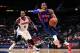 ATLANTA, GA - APRIL 8: Greg Monroe #10 of the Detroit Pistons drives to the basket against Paul Millsap #4 of the Atlanta Hawks on April 8, 2014 at Philips Arena in Atlanta, Georgia. NOTE TO USER: User expressly acknowledges and agrees that, by downloadi
