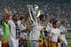 MADRID, SPAIN - MAY 25: Real Madrid player Sami Khedira (L) lifts the trophy during the Real Madrid celebration the day after winning the UEFA Champions League final at Santiago Bernabeu Stadium on May 25, 2014 in Madrid, Spain. Real Madrid CF achieves t