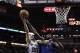 SAN ANTONIO, TX - MAY 4: Manu Ginobili #20 of the San Antonio Spurs shoots over DeJaun Blair #45 of the Dallas Mavericks in Game Seven of the Western Conference Quarterfinals during the 2014 NBA Playoffs at the AT&T Center on May 4, 2014 in San Antonio,