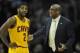 Apr 5, 2014; Cleveland, OH, USA; Cleveland Cavaliers head coach Mike Brown talks to guard Kyrie Irving (2) in the first quarter against the Charlotte Bobcats at Quicken Loans Arena. Mandatory Credit: David Richard-USA TODAY Sports